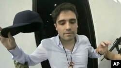 FILE - This frame grab from video, provided by the Mexican government, shows Ovidio Guzman Lopez being detained in Culiacan, Mexico, Oct. 17, 2019. 