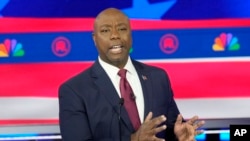FILE - Sen. Tim Scott speaks during a Republican presidential primary debate in Miami, Florida, Nov. 8, 2023.