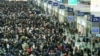 Chinese Endure New Year Travel Rush for Taste of Home