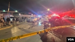 An image taken from video shows members of the Mexican Army at the site of a fire at an immigration detention facility in Ciudad Juarez, Mexico, March 28, 2023. (Cesar Contreras/VOA Spanish)