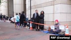 Aleksandra Bielakowska, left, and Shataakshi Verma of Reporters Without Borders pictured outside a Hong Kong court for Jimmy Lai's trial in December 2023. Authorities on April 10 expelled the media advocate from Hong Kong. (Courtesy RSF)