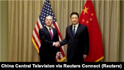 Chinese Public Security Minister Wang Xiaohong, right, held a meeting with U.S. Homeland Security Secretary Alejandro Mayorkas in Vienna, Feb. 18, 2024. (Screenshot of China Central Television via Reuters Connect)