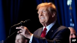 Republican presidential candidate and former U.S. President Donald Trump speaks at a primary election night party at the South Carolina State Fairgrounds in Columbia, South Carolina, Feb. 24, 2024. 