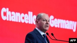German Chancellor Olaf Scholz speaks at the Romanian Parliament's headquarters during the "We stand together for our Europe!" conference and leaders meeting organized by The Party of European Socialists in Bucharest, Romania, April 6, 2024.