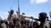 FILE - Armed al-Shabab fighters ride on pickup trucks just outside the Somali capital of Mogadishu, Dec. 8, 2008. Al-Shabab has reversed all Somali National Army gains made over the last two years, U.S. defense officials say.