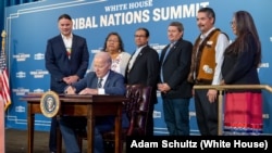 President Joe Biden signs the Executive Order on Reforming Federal Support for Tribal Nations, Wednesday, December 6, 2023, at the White House Tribal Nations Summit at the U.S. Department of the Interior in Washington, D.C.