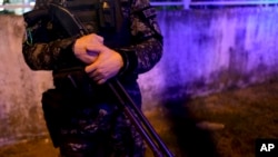 A police officer stands guard on a street in Rosario, Argentina, April 8, 2024.