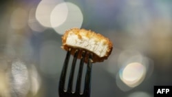 FILE - A nugget made from lab-grown chicken meat is seen during a media presentation in Singapore, the first country to allow the sale of meat created without slaughtering any animals, on Dec. 22, 2020.