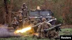FILE - A Philippine soldier fires a Javelin anti-tank weapon system during a live exercise as part of the annual U.S.-Philippines joint military exercises called "Balikatan" at Fort Magsaysay, Nueva Ecija province, April 13, 2023.
