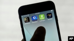 FILE - FanDuel, DraftKings and other online gambling apps are displayed on a phone in San Francisco, Sept. 26, 2022.