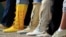 Participants put their feet down during the "Rock Your Mocs" celebration at the Indian Pueblo Cultural Center in Albuquerque, New Mexico, on Nov. 15, 2013. Today, Native American women are putting their feet down and demanding equal pay.