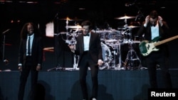 FILE - The 1975 perform at the Brit Awards at the O2 Arena in London, Feb. 20, 2019. The pop rock groud said, July 23, 2023, they have canceled shows in Taiwan and Indonesia.