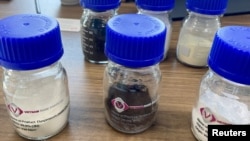 FILE - Rare earth oxide samples are seen at mining company VTRE in Hanoi, Vietnam, Sept. 7, 2023. 