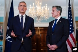 Secretary of State Antony Blinken, right, looks to NATO Secretary General Jens Stoltenberg as the speaks at the State Department in Washington, June 13, 2023.