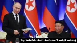 Russia's President Vladimir Putin and North Korea's leader Kim Jong Un attend a state reception in Pyongyang, North Korea, June 19, 2024. (Sputnik/Vladimir Smirnov/Pool via Reuters)