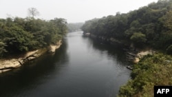 FILE - The Cross River, shown here on Feb. 1, 2018, serves as the border between Nigeria and Cameroon near Mfum, Nigeria. On June 27, 2024, the nations announced a plan to settle disputes over several border locations by the end of 2025.