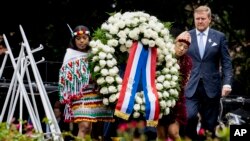 Dutch King Willem-Alexander lays a wreath at the slavery monument to commemorate the anniversary of the country abolishing slavery in Amsterdam, Netherlands, July 1, 2023.