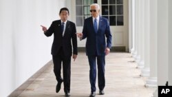 FILE - President Joe Biden and Japanese Prime Minister Fumio Kishida walk along the colonnade of the White House after a State Arrival Ceremony, April 10, 2024, in Washington.