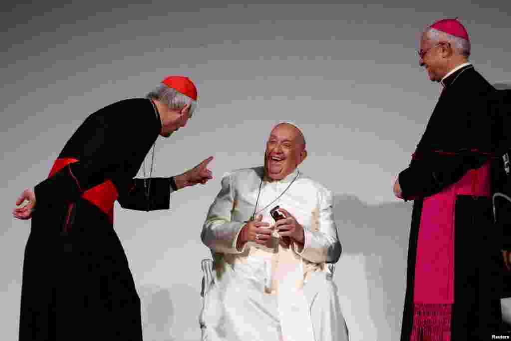 Pope Francis with cardinal Matteo Zuppi and Italian archbishop of Catania Luigi Renna standing next to him, attends the 50th Social Week of Catholics at the "Generali Convention Center" in Trieste, Italy.