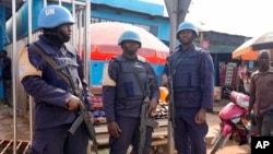 FILE - United Nations peacekeepers stand in the market in Bouar, Central African Republic, March 8, 2024.