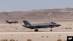 FILE - An Israeli F-35 lands at Ovda airbase near Eilat, southern Israel, Oct. 24, 2021. Israel will buy 25 F-35s from the U.S., the Israeli Defense Ministry announced, July 2, 2023.