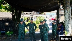 Taiwanese military soldiers rest in the shade during a live-firing exercise with U.S. made Stinger missile in Pingtung, Taiwan, July 4, 2023