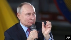 Russian President Vladimir Putin speaks to students and employees of the Chelyabinsk Forge-and-Press Plant in Chelyabinsk, Russia, Feb. 16, 2024.