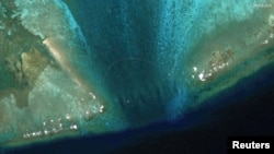 A floating barrier is placed at the entrance of Scarborough Shoal in the South China Sea, Feb. 22, 2024. (Maxar Technologies/Handout via Reuters)