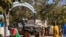 FILE - Burkina Faso mutinous soldiers guard the entrance of the national television station in Ouagadougou, Jan. 24, 2022. Human Rights Watch has criticized the country for omitting human rights abuses in a report to an African human rights commission.