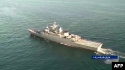 FILE - A photo obtained from video by Iranian state TV IRIB on Dec. 27, 2019, shows the Iran navy frigate Sahand during Iran-Russia-China joint naval drills in the Indian Ocean. Iran on Oct. 19, 2024, joined Russia and Oman for more naval drills on the Indian Ocean.