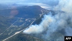 This handout image provided by the BC Wildfire Service on June 5, 2023, shows an aerial view of the Pigeon Creek wildfire near Peachland, British Columbia, Canada. 