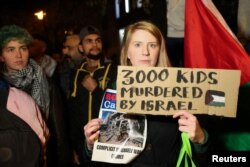 People take part in a protest in support of Palestinians in Gaza, amid the ongoing conflict between Israel and Hamas, in Brussels, Belgium, Oct. 26, 2023.