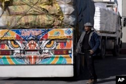 An Egyptian truck driver carrying humanitarian aid for the Gaza Strip goes through the Kerem Shalom Crossing in southern Israel on Dec. 22, 2023.