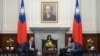 In this photo released by the Taiwan Presidential Office, Taiwan's President Tsai Ing-wen, right, talks to US Rep. Mike Gallagher on the Chinese Communist Party, left, in Taipei, Taiwan, Feb. 22, 2024. 