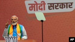Indian Prime Minister Narendra Modi speaks during an event in which he released his ruling Bharatiya Janata Party's manifesto for the upcoming national parliamentary elections in New Delhi, India, April 14, 2024. 