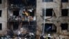 Firefighters works at the site of a residential building heavily damaged during a Russian missile attack in Kyiv on January 2, 2024. (Valentyn Ogirenko/Reuters)