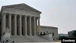 FILE - Security officers stand outside the U.S. Supreme Court building in Washington, DC. (Photo by Diaa Bekheet)