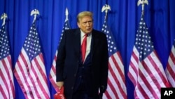 FILE - Republican presidential candidate former President Donald Trump attends a campaign rally in Waterford Township, Michigan, Feb. 17, 2024.