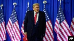 FILE - Republican presidential candidate Donald Trump attends a campaign rally in Waterford Township, Mich., Feb. 17, 2024.