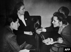 FILE — Women attend a general assembly during sessions of the United Nations Assembly at the Palais de Chaillot in Paris, October 1948.