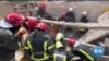 Searchers Dig for Bodies in Rubble of Lviv Apartment Complex 