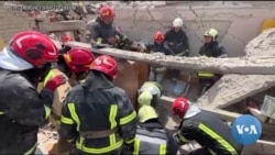 Searchers Dig for Bodies in Rubble of Lviv Apartment Complex 