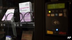 FILE - A vending machine is stocked with emergency contraceptives at Odegaard Library on the campus of the University of Washington, June 2, 2023, in Seattle. 
