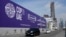 Cars pass by a billboard advertising COP28 at Sheikh Zayed Highway in Dubai, United Arab Emirates, Nov. 27, 2023.