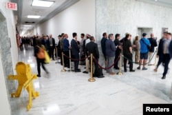 People wait in line to try to enter a hearing on unidentified anomalous phenomena on Capitol Hill in Washington, July 26, 2023.