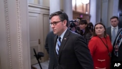 FILE - Speaker Mike Johnson enters the House chamber, Feb. 6, 2024. The Senate this month approved a package that contained military aid for Ukraine, but Johnson sent the House home for a two-week recess without bringing the measure up for a vote.