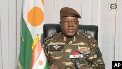 In this image taken from video provided by ORTN, Gen. Abdourahamane Tchiani makes a statement, July 28, 2023, in Niamey, Niger.