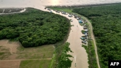 This photo taken on March 13, 2023 shows an aerial view of Chong Prolay floating village on Tonle Sap lake in Siem Reap province. 