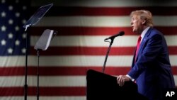 FILE - Former President Donald Trump speaks during a rally Dec. 17, 2023, in Reno, Nev. Maine's secretary of state on Dec. 28 declared Trump ineligible for the White House under the U.S. Constitution’s insurrection clause.