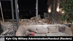 Kyiv officials released this photo showing an apartment damaged during a Russian drone strike in Kyiv, Ukraine, Dec. 22, 2023.